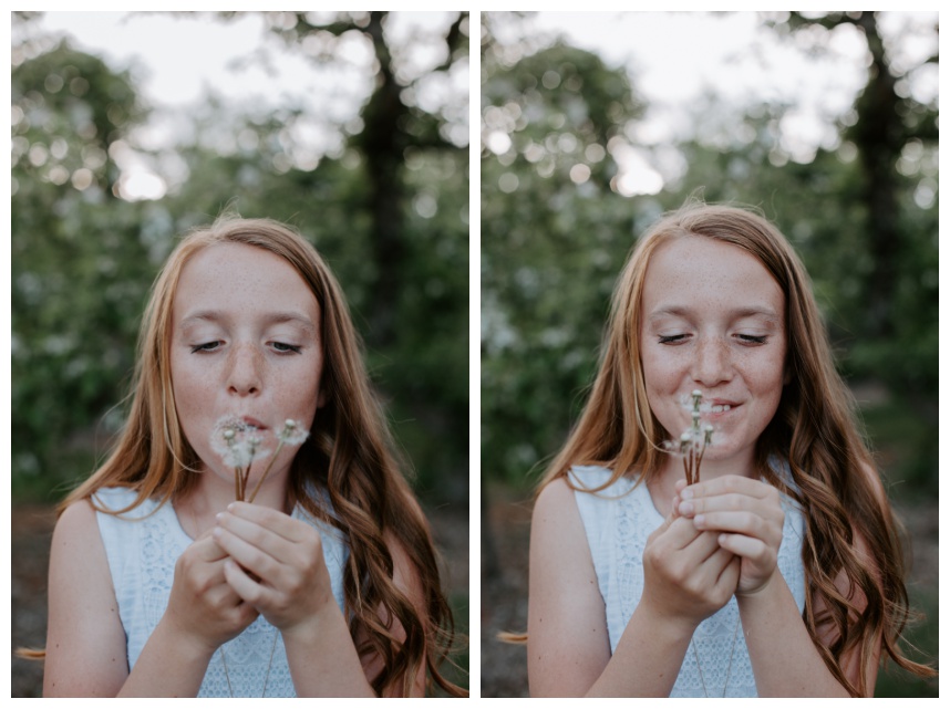 Girl blowing dandelion photo