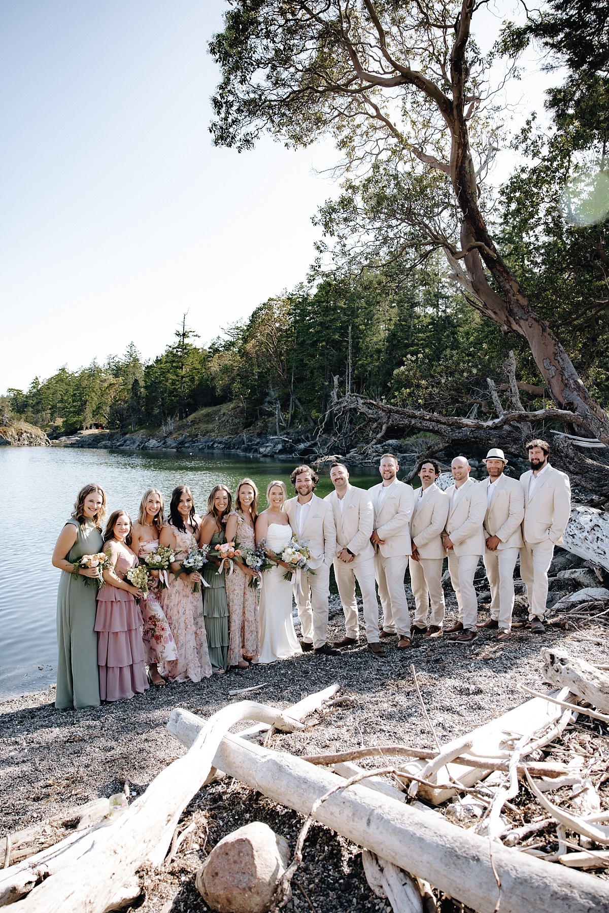 Wedding party cheering during sunset portraits