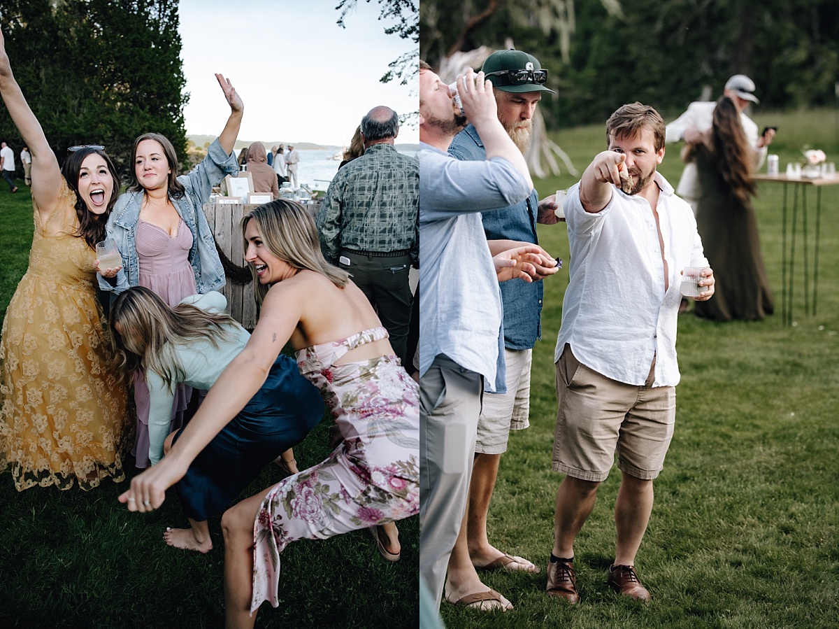 Guests mingling on lawn at Pebble Cove Farm during Orcas Island wedding

